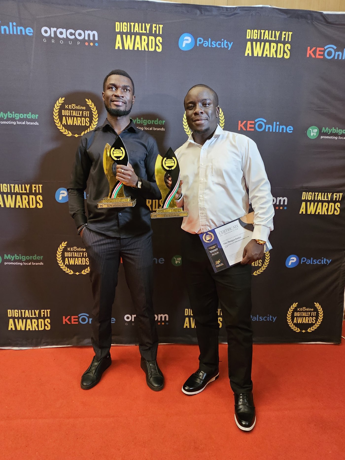 David Esabwa and the Elite Designs Kenya team holding their Digitally Fit Awards trophies